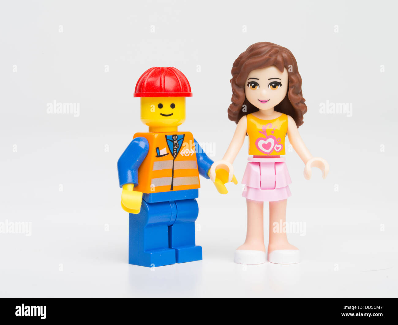 Olivia a Lego Friends mini-doll introduced in 2012 to appeal to girls, and  a traditional male minifigure Stock Photo - Alamy