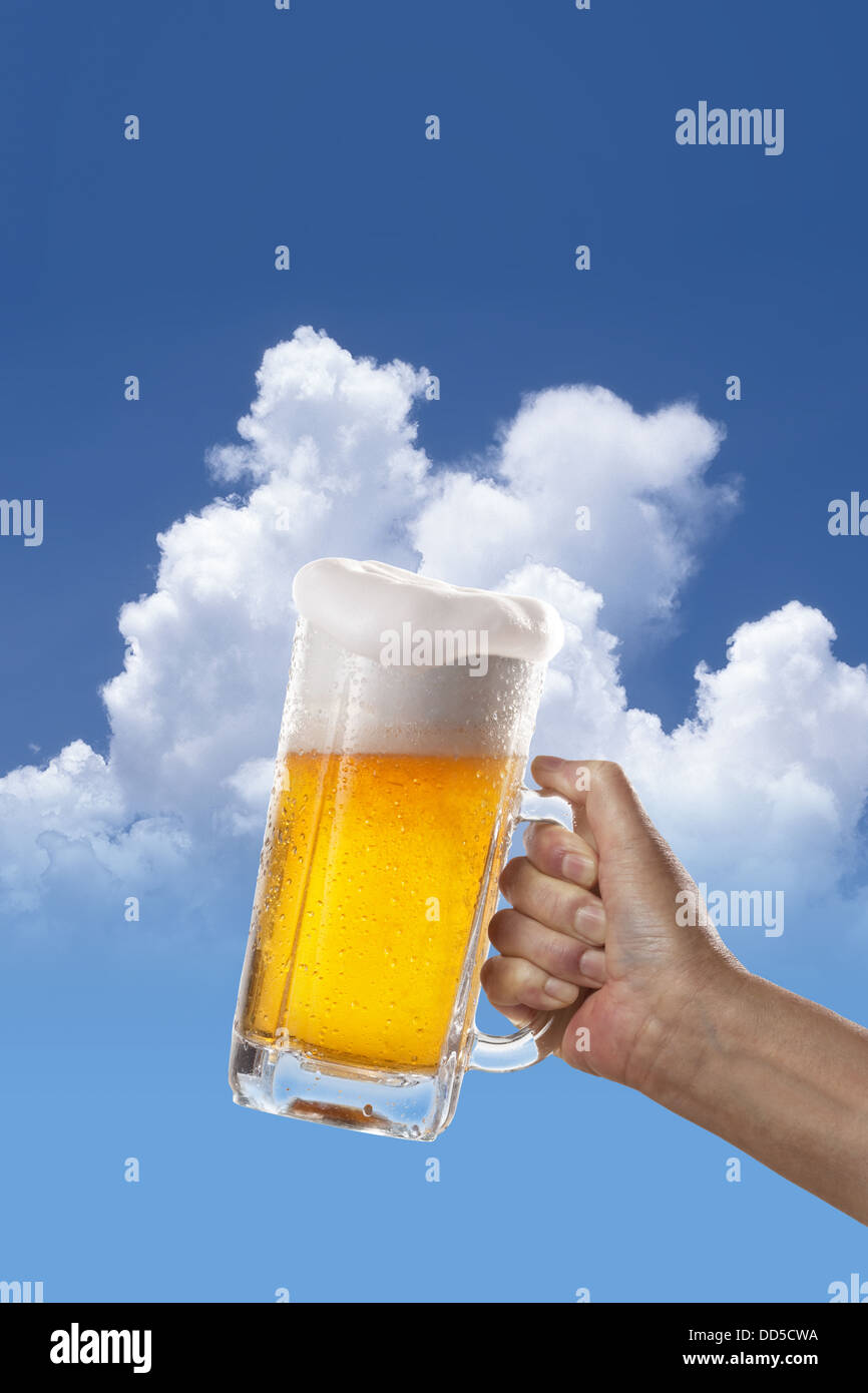 Glass of beer and sky in the background Stock Photo