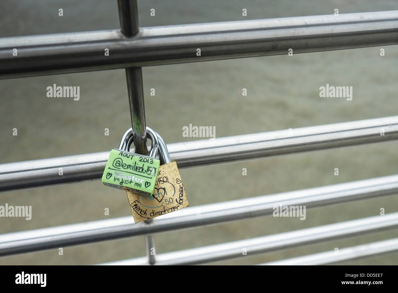 Two love padlocks attached to the Golden Jubilee Bridge in London Stock