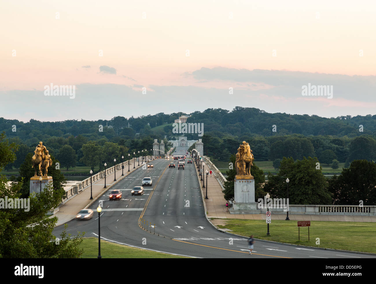 Arlington Memorial bridge leading across Potomac river to Arlington Cemetery in Virginia at sunset, Washington DC Stock Photo