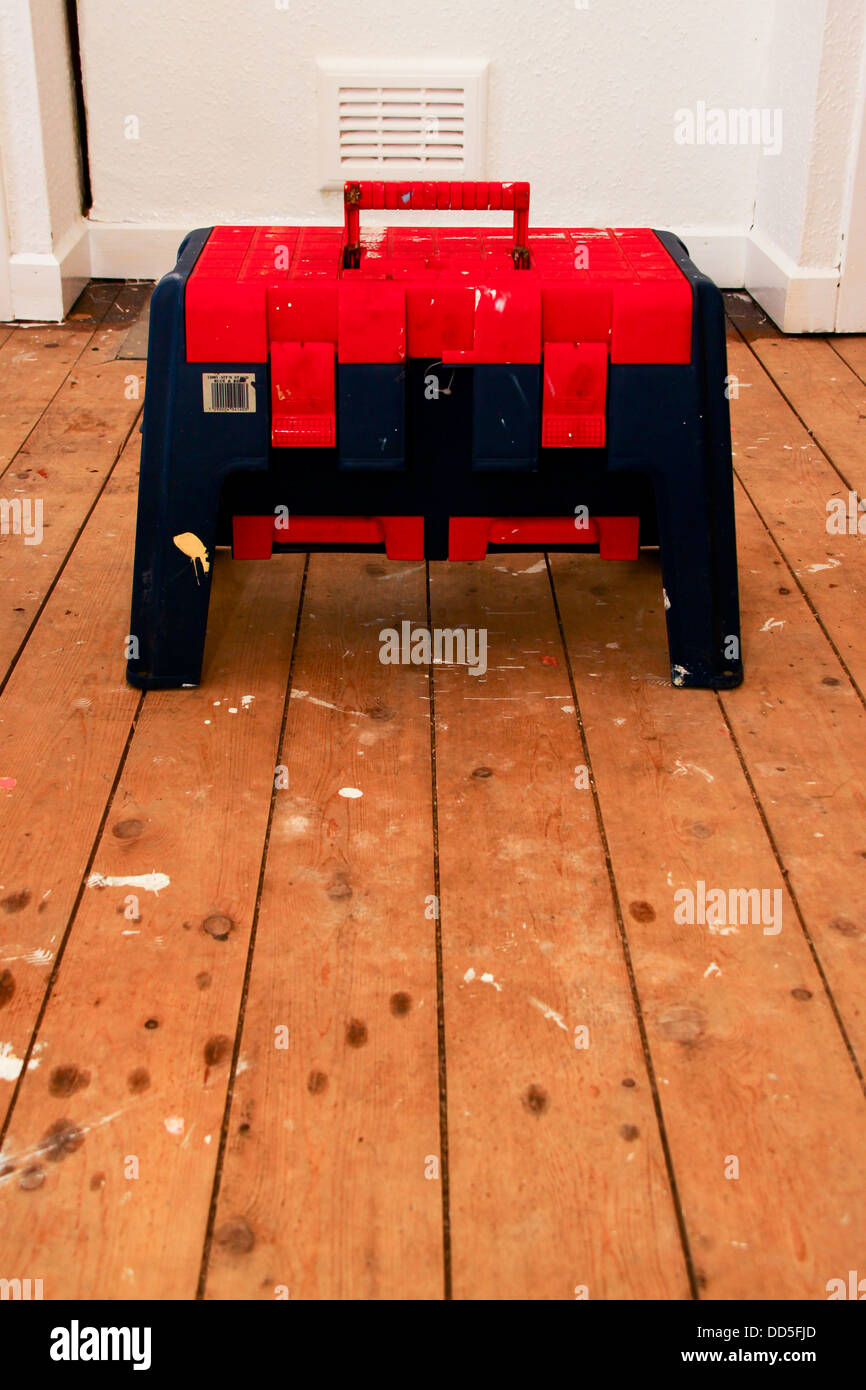 Step stool toolbox on bare floorboards Stock Photo Alamy
