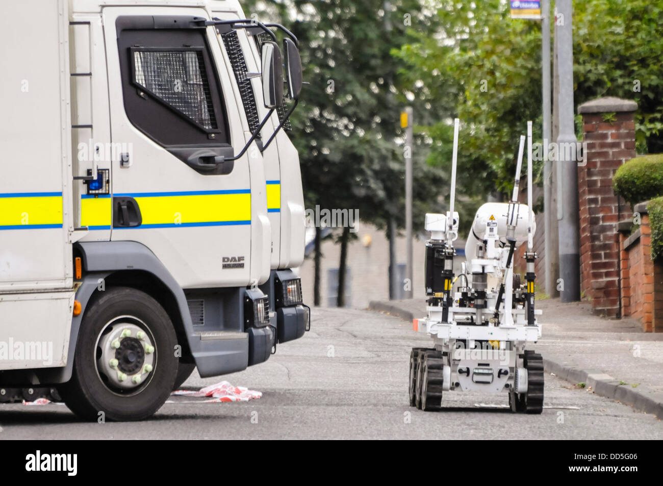 Newtownabbey, Northern Ireland. 26th Aug, 2013. A Northrop Grumman Andros robot moves off to deal with a suspect device found outside the gates of Felden Youth Training Centre.  The robot carried out a single controlled explosion and the device was later declared to be an elaborate hoax. Credit:  Stephen Barnes/Alamy Live News Stock Photo