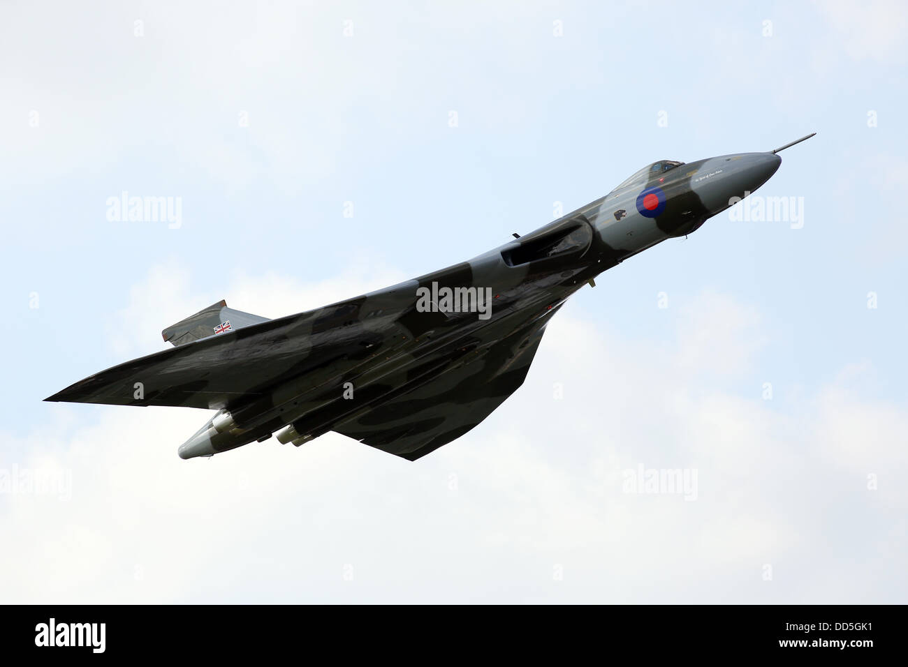 The Vulcan pictured  at Wings and Wheels, Dunsfold, Surrey today with a spectacular display.The "Wings" of the event treats visitors to outstanding and diverse 5 hour air displays which have confirmed participation from show favourites (on both days) the Red Arrows, Avro Vulcan, Battle of Britain Memorial Flight (Spitfire, Lancaster, Hurricane), Typhoon, Chinook, Tucano, RN Swordfish and Sea Fury, Apache Attack Helicopter, RN Lynx Black Cat Solo Helicopter Display, Team Breitling Wingwalkers, Glider FX and the Blades. Stock Photo