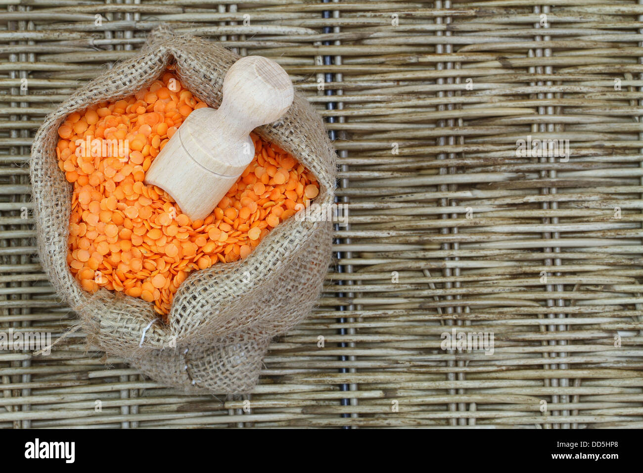 Red lentils in jute bag with copy space Stock Photo