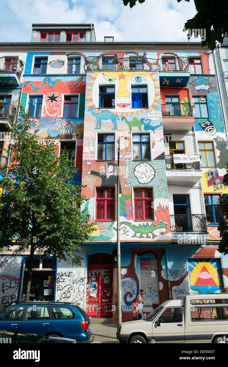 Colourful art painted on apartment buildings in bohemian Friedrichshain district of Berlin Germany Stock Photo