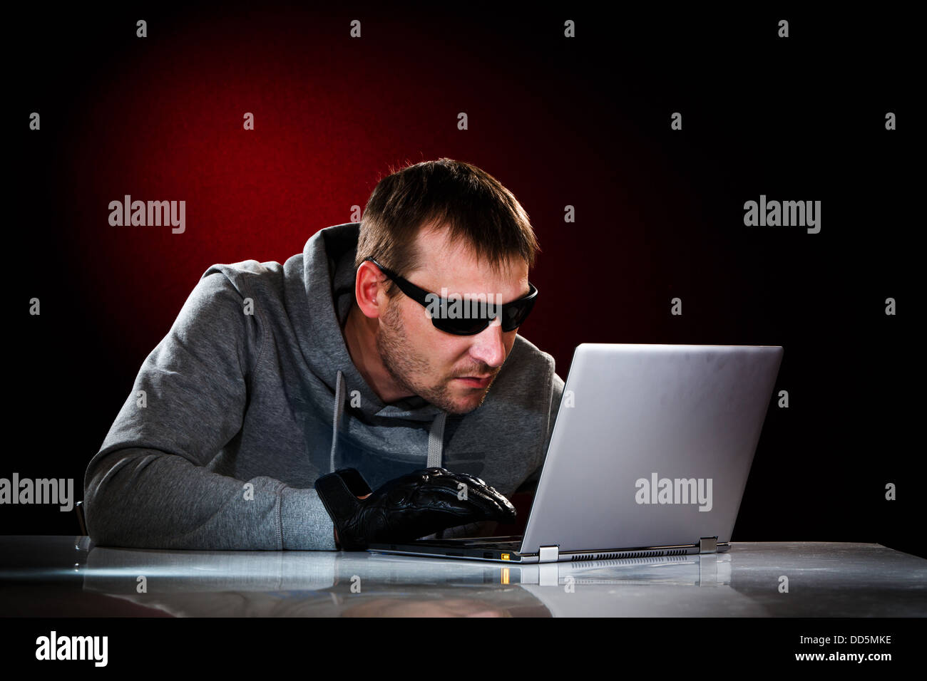 Hacker in a sunglasses with laptop Stock Photo Alamy