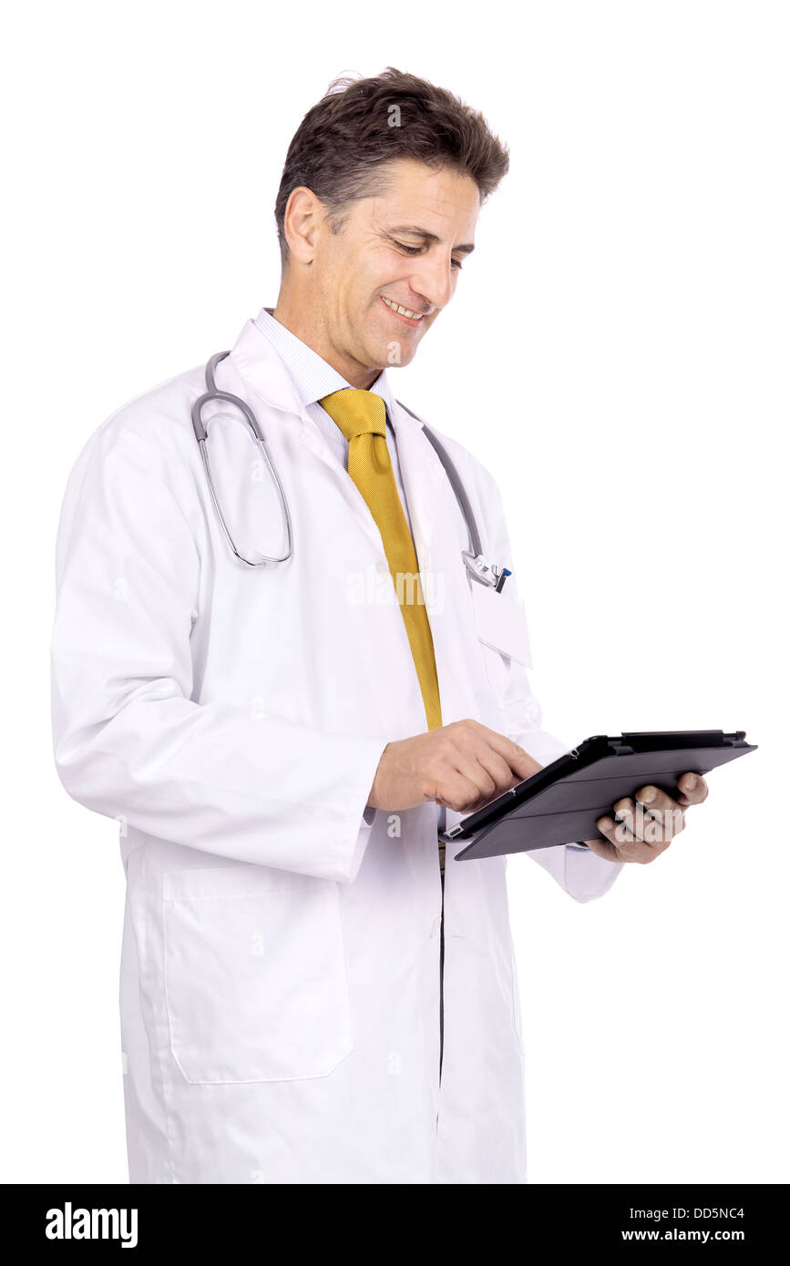 Doctor with tablet isolated against a white background Stock Photo - Alamy