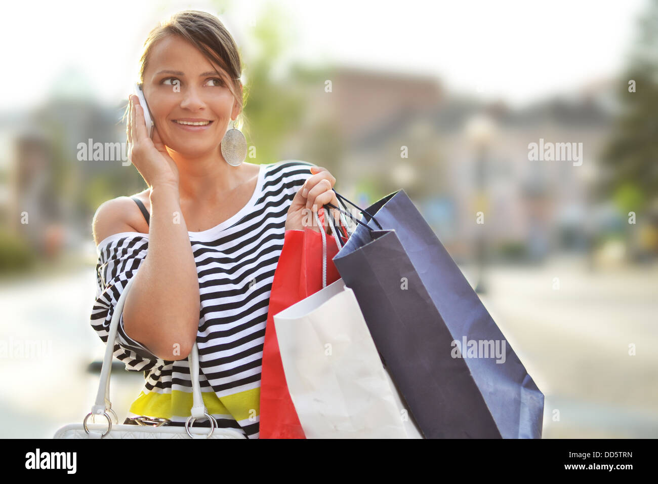 beautiful young woman with shopping bags Stock Photo - Alamy