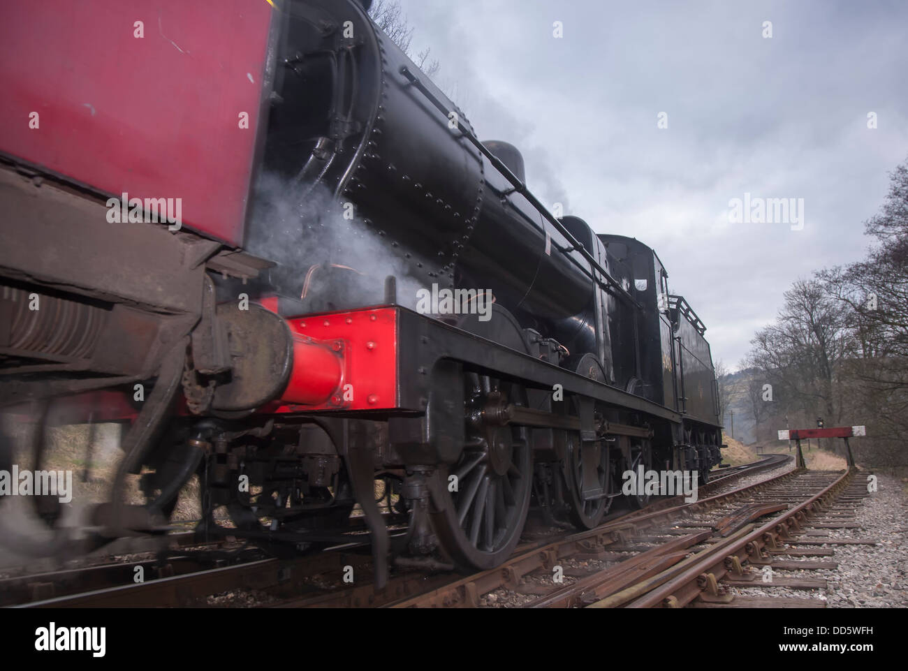 A restored steam locomotive reversing into sidings Stock Photo