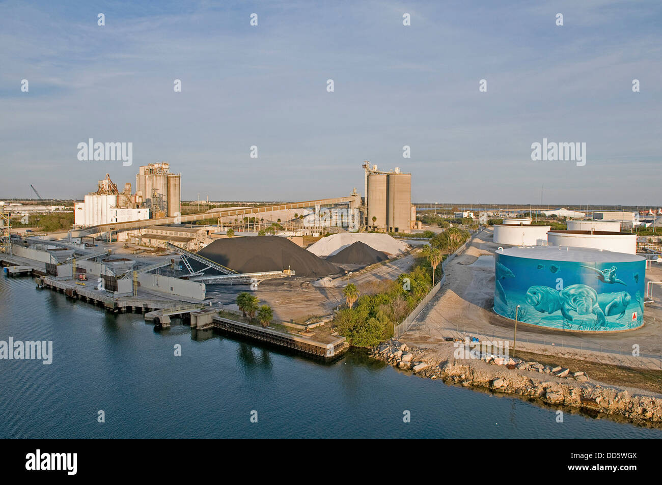USA, Florida, Tampa, An attempt to put an environment friendly face on oil storage tanks along Maritime Boulevard. Stock Photo