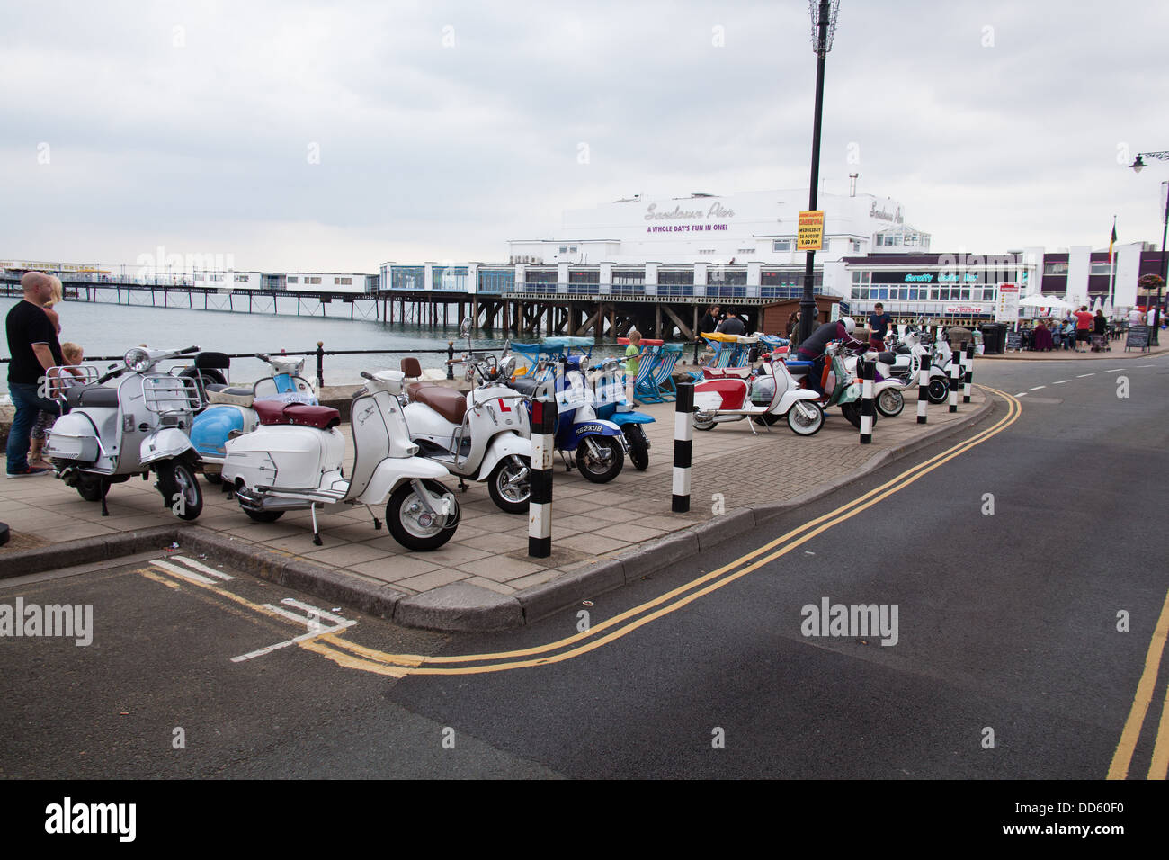 Scooters parked outside Sandown Pier, Sandown, Isle of Wight, Hampshire, England Stock Photo