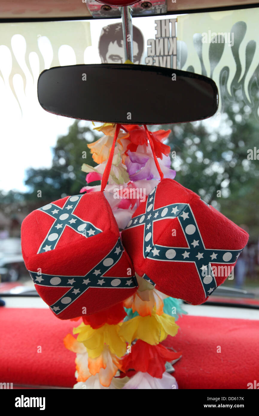 detail of large soft dice hanging from rear view mirror of Classic car, Confederate flag rockabilly sixties style Stock Photo