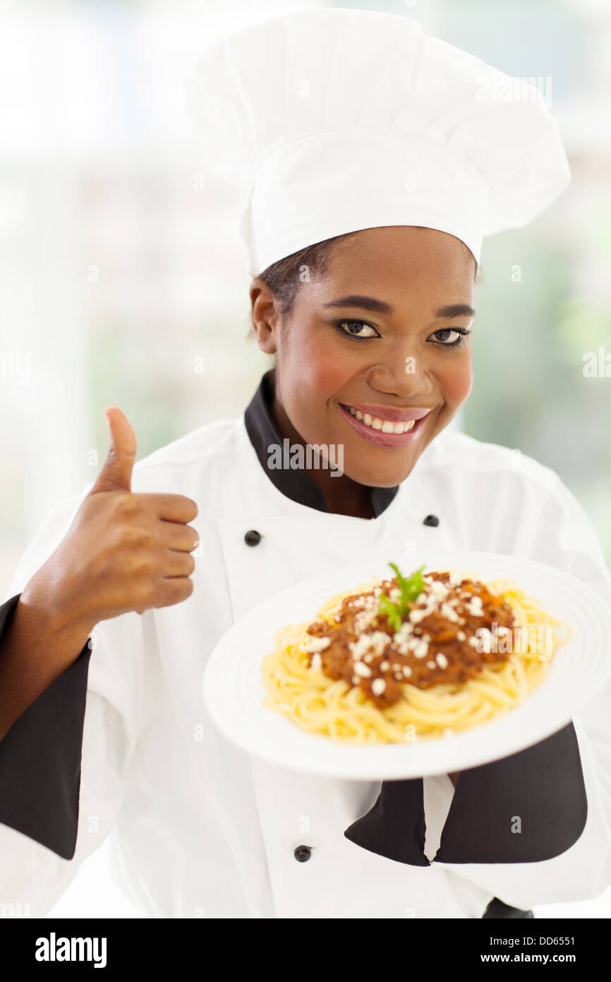 smiling female African American chef giving thumb up Stock Photo Alamy