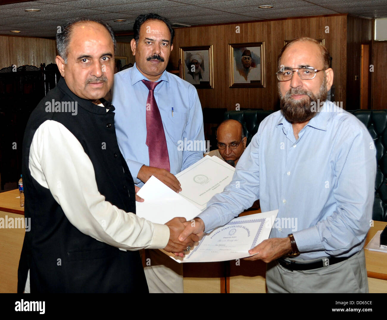 ISLAMABAD/ PAKISTAN . 27 august 2013 fazal satter additional director general pakistan postal services distributing certificates among the participants of a workshop of chief/senior post masters at postal staff college at pak capital Handout by Pakistan informtion department   (Photo by PID/Deanpictures/Alamay Live News Stock Photo