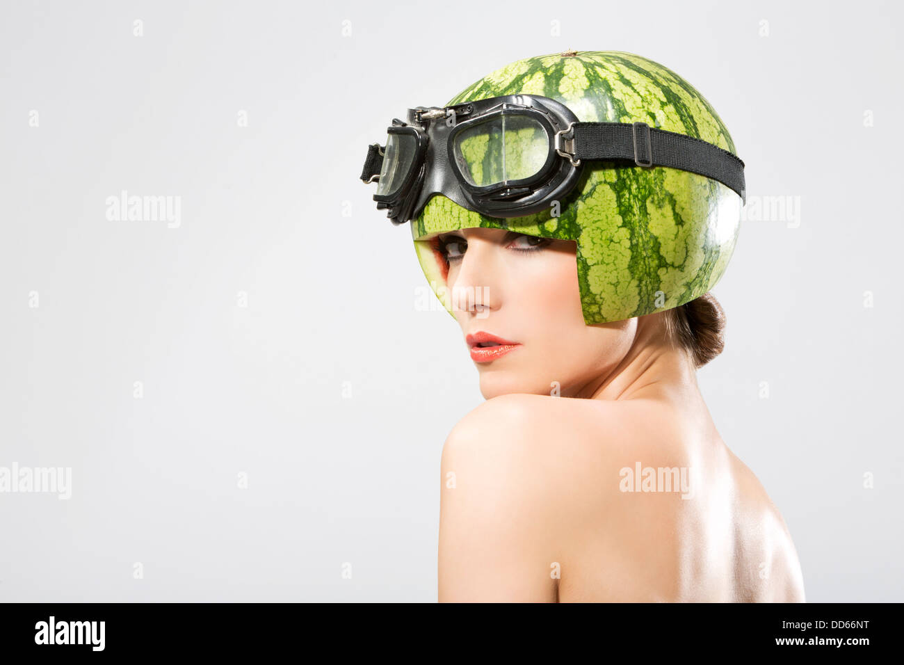 Young woman wearing watermelon helmet, close up Stock Photo Alamy