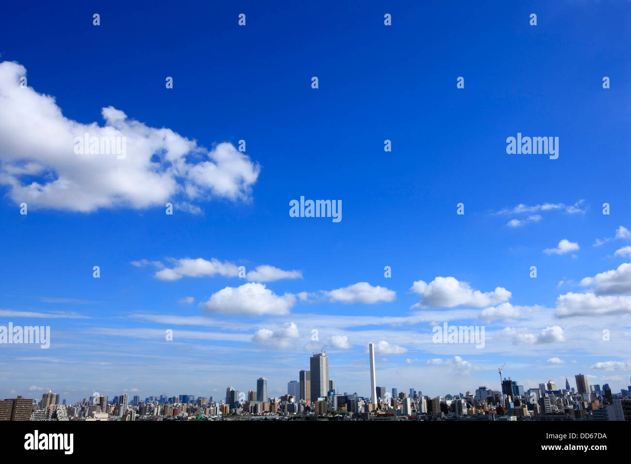 Blue sky with clouds and cityscape Stock Photo - Alamy