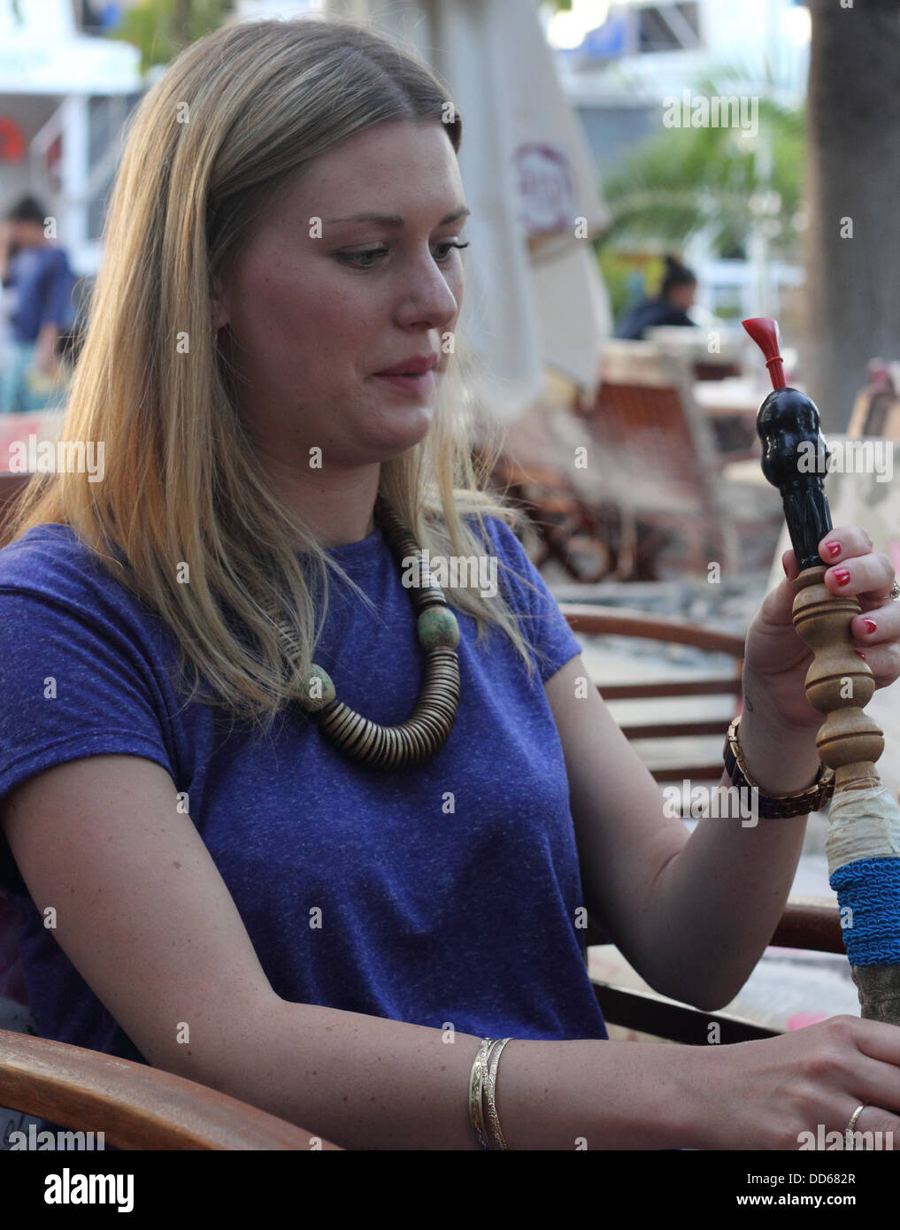 smoking a hookah water pipe Stock Photo Alamy