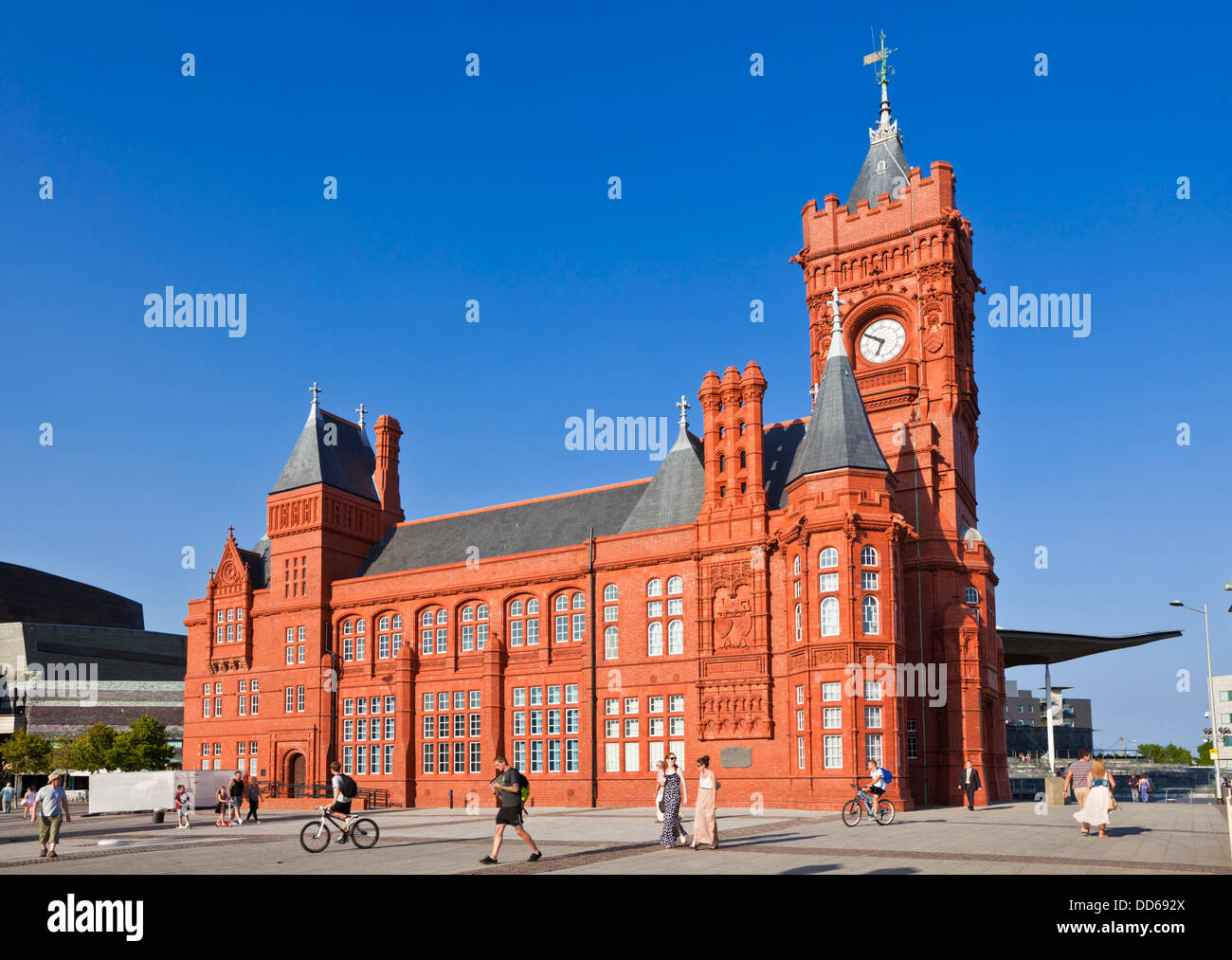 The restored Pierhead building in Cardiff Bay with tourists Cardiff bay area South Glamorgan South Wales GB UK EU Europe Stock Photo