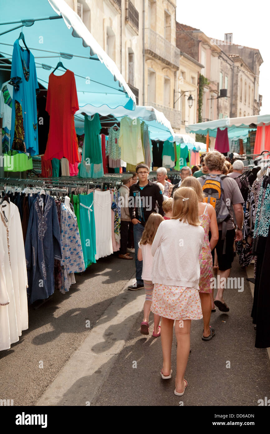 A family shopping for clothes in a french street market, Ste Liverade sur Lot, Lot-et-Garonne, France europe Stock Photo