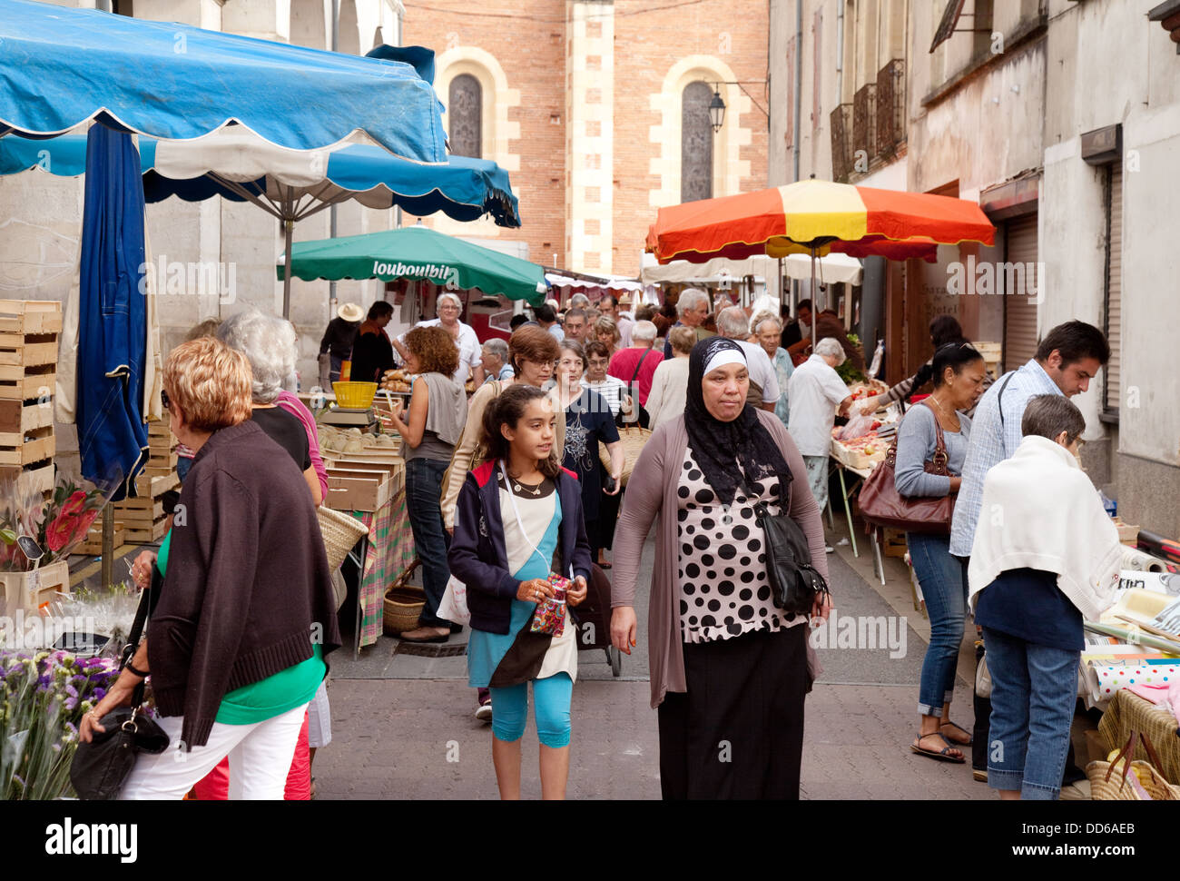 A moslem family shopping in a French market, Ste Liverade sur Lot, Lot et Garonne, France Europe Stock Photo