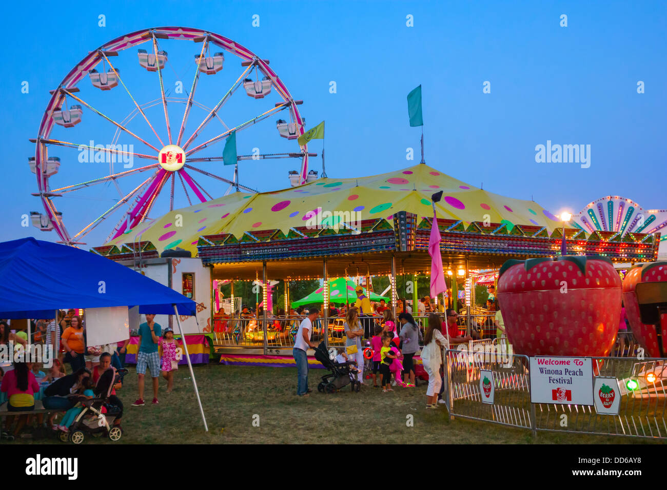 People having fun at the rides of the Winona Peach Festival near Hamilton, Ontario, Canada. Stock Photo