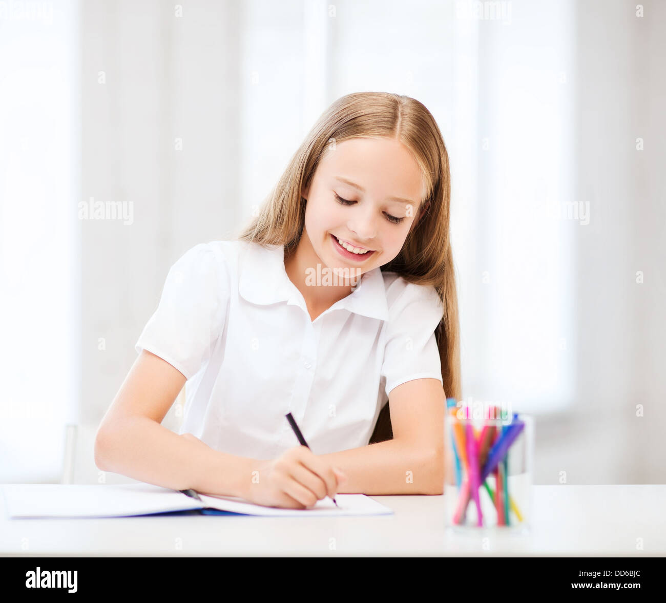 little student girl drawing at school Stock Photo - Alamy