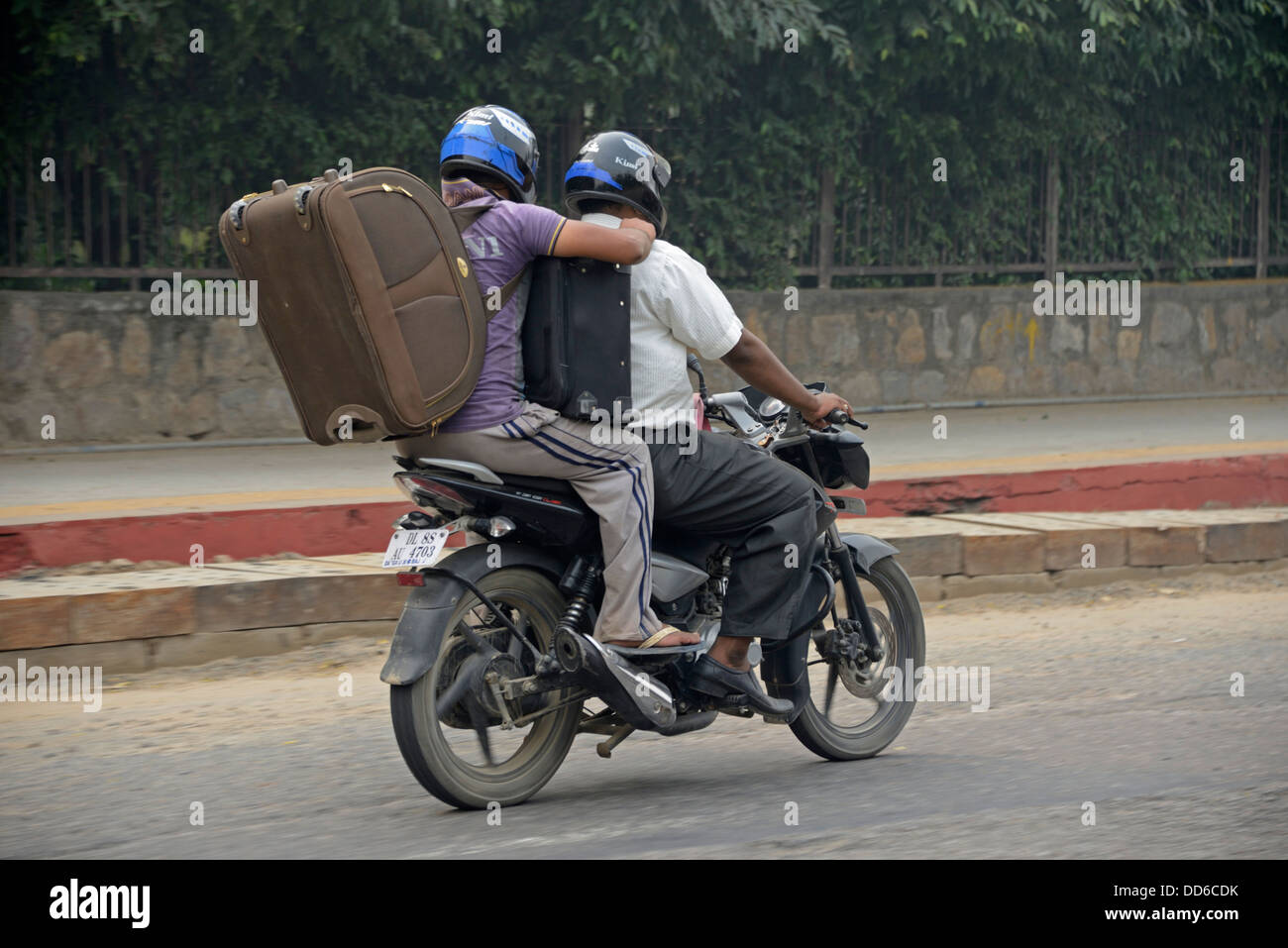 All the baggage they could carry on a motorcycle in Delhi, India Stock