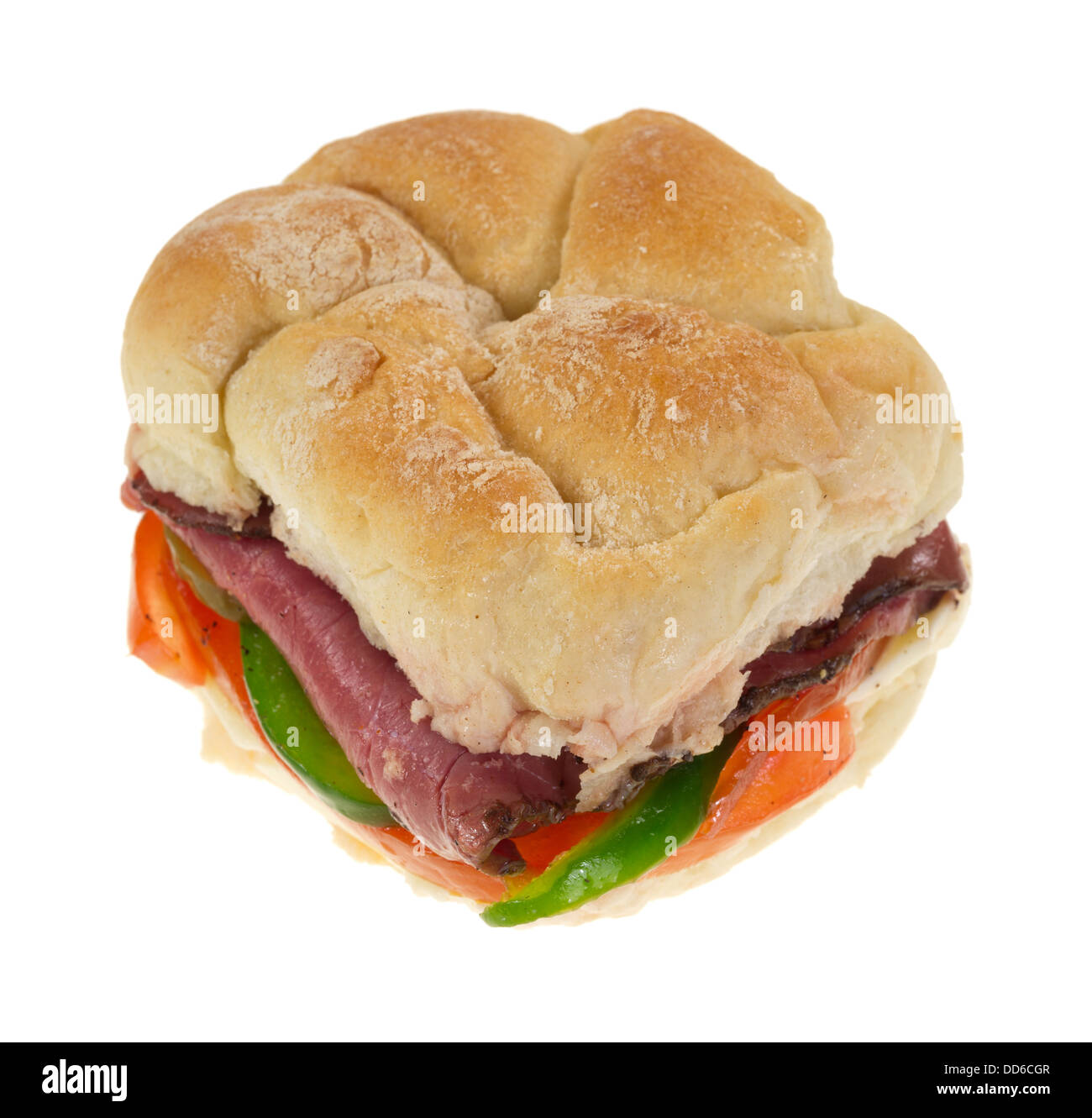 A bulky roll sandwich with roast beef and vegetables on a white background. Stock Photo