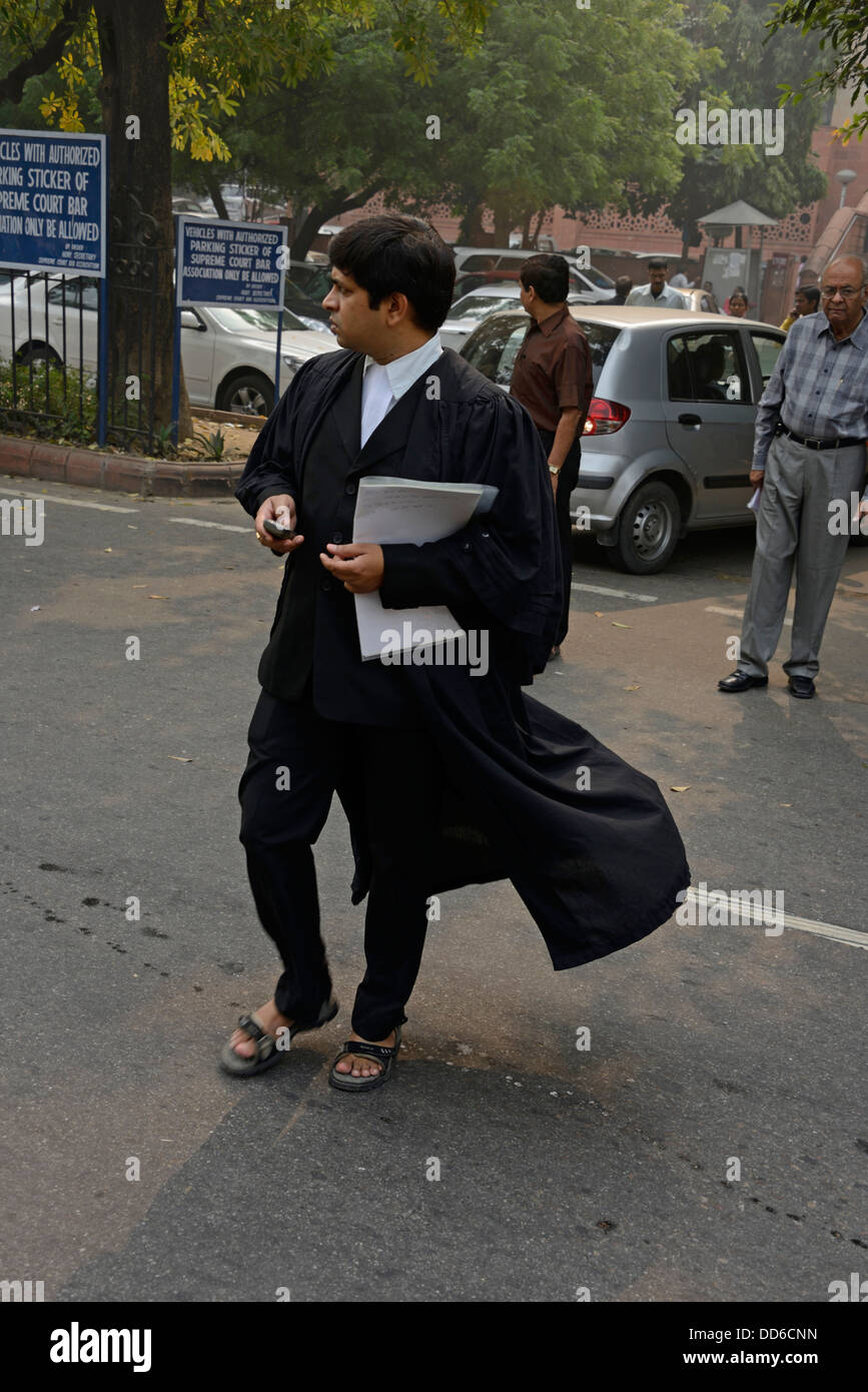 An Indian lawyer at the main entrance to the Supreme Court  of India in Janak Puri, New Delhi, India Stock Photo