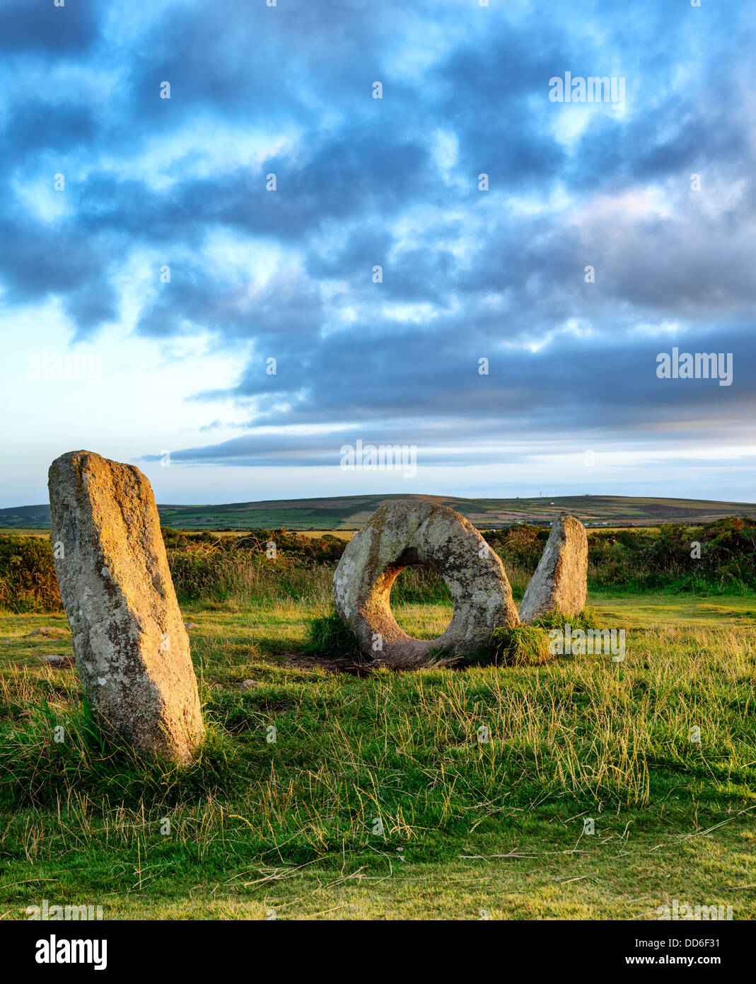 The Men-an-Tol standing stones Near Penzance in Cornwall, local legend says that passing a person through the holed stone cures Stock Photo