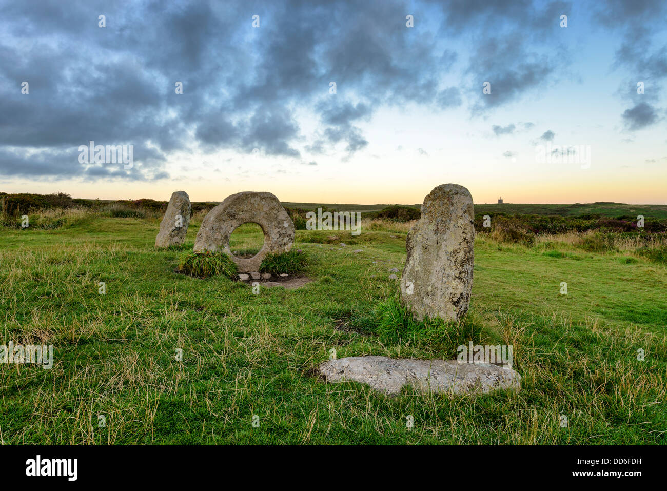 The Men-an-Tol standing stones Near Penzance in Cornwall, local legend says that passing a person through the holed stone cures Stock Photo