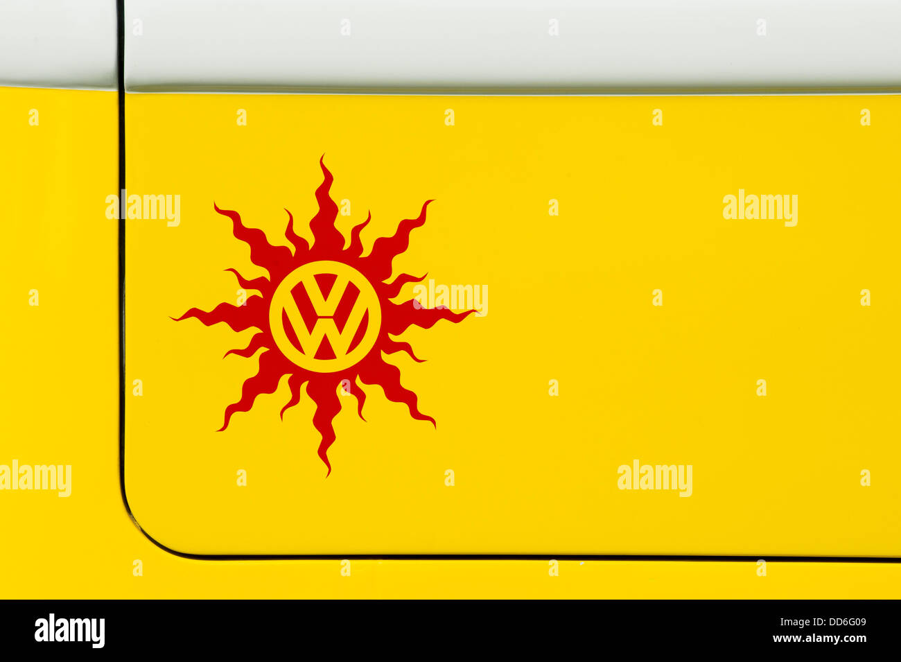 Yellow Volkswagen camper van rear end VW sun sticker Stock Photo