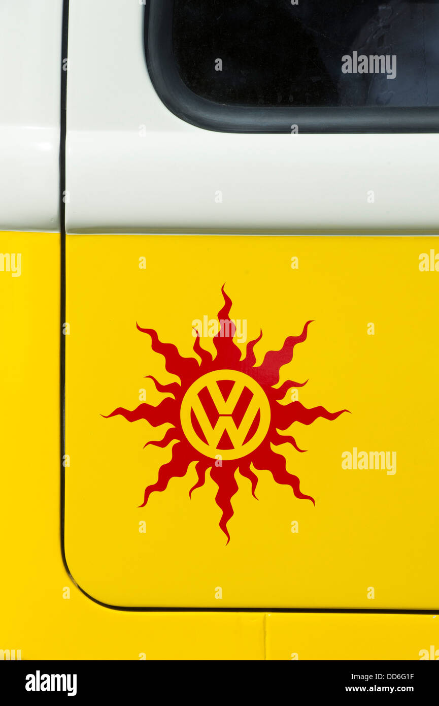 Yellow Volkswagen camper van rear end VW sun sticker Stock Photo