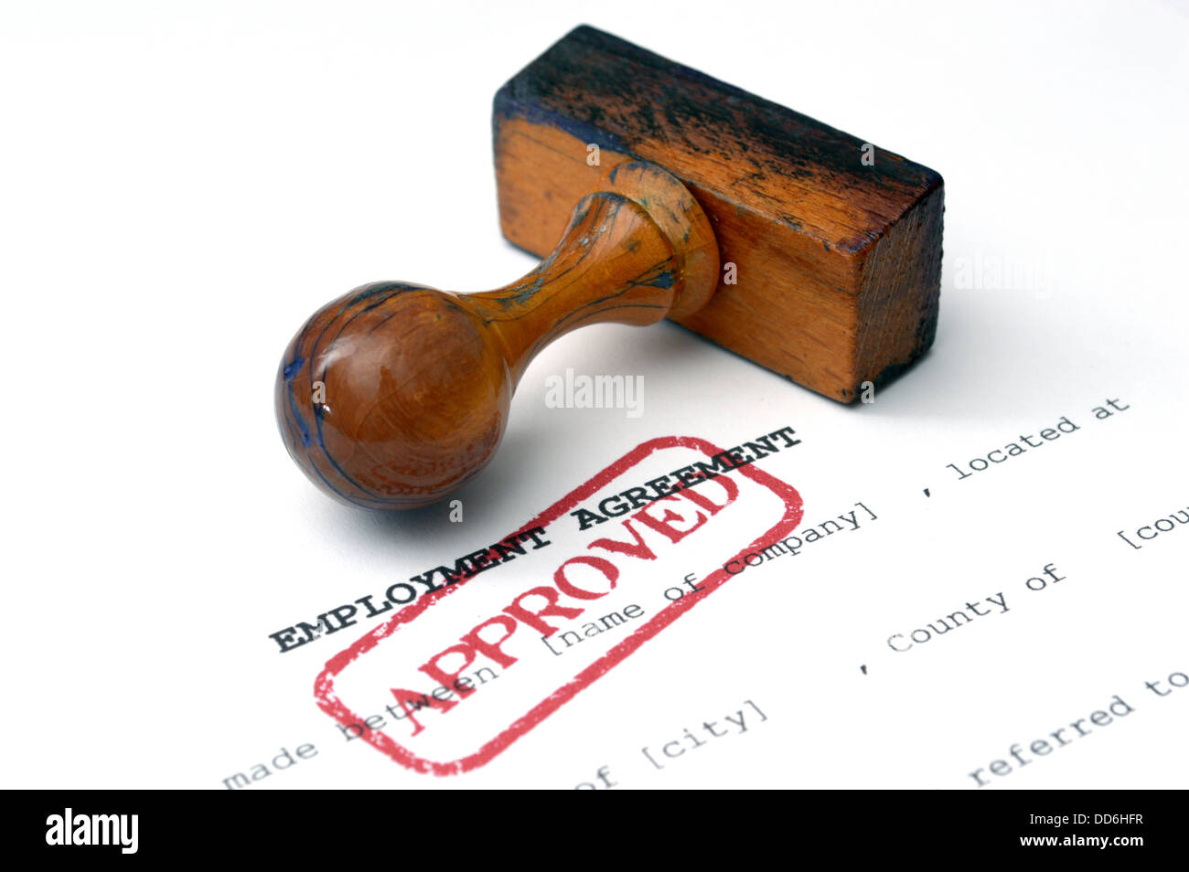 Employment agreement approved with stamp on white paper Stock Photo - Alamy