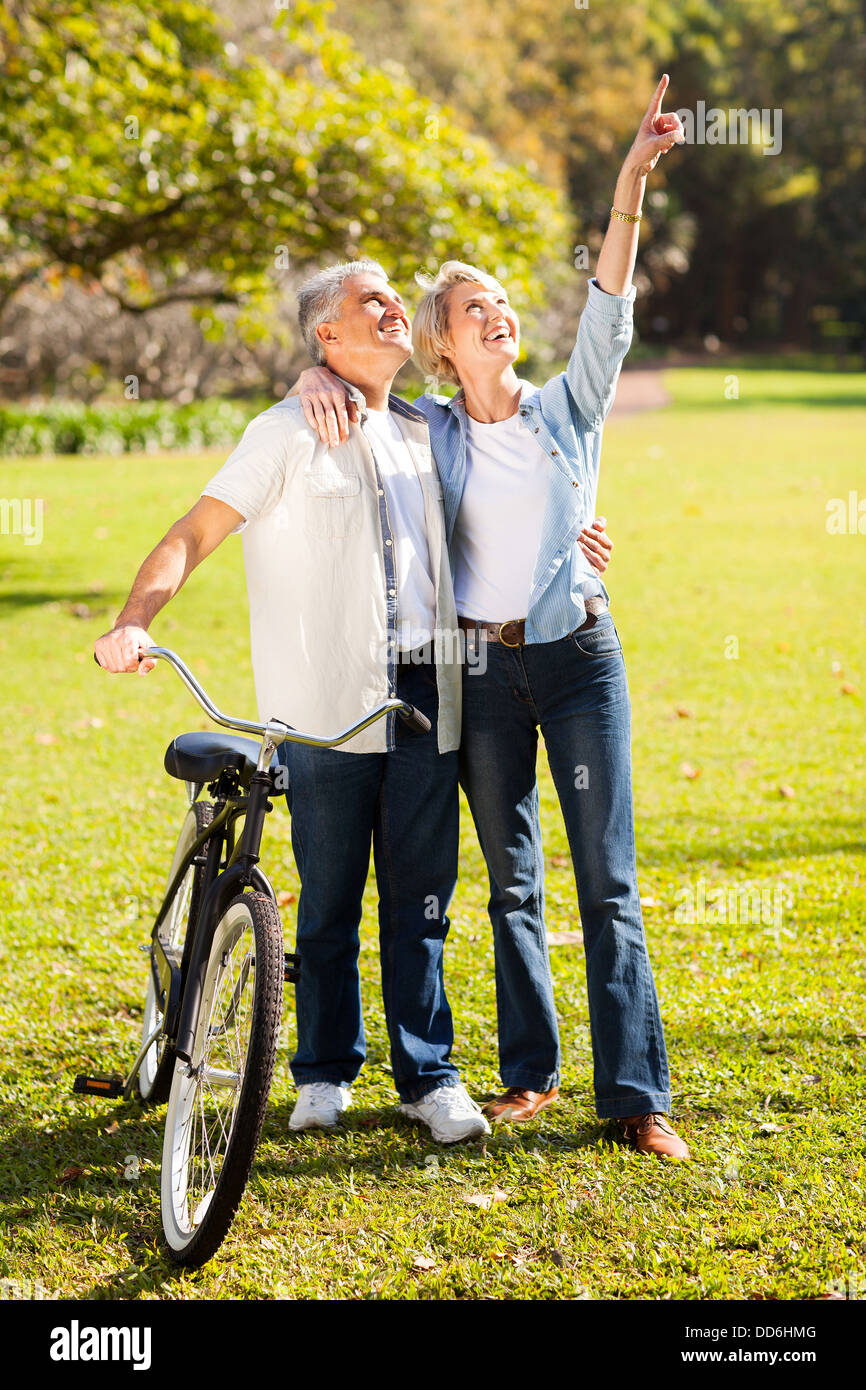 https://c8.alamy.com/comp/DD6HMG/happy-middle-aged-couple-walking-in-park-DD6HMG.jpg