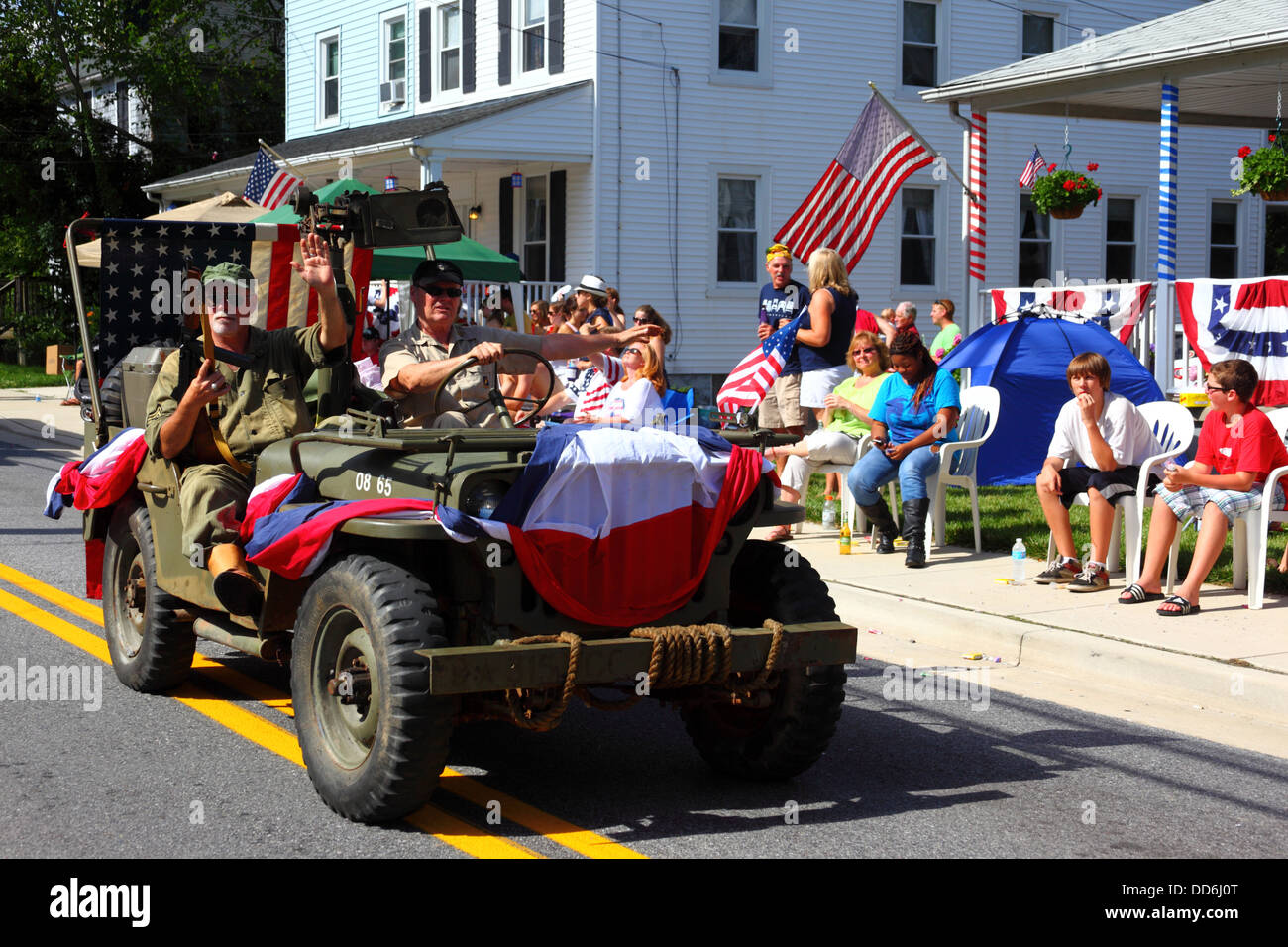 Soldiers in army jeep taking part in 4th of July Independence Day parades, Catonsville, Maryland, USA Stock Photo