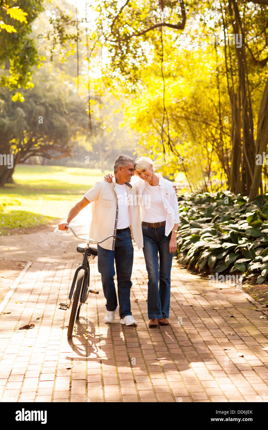 cute senior couple walking outdoors at the park Stock Photo - Alamy