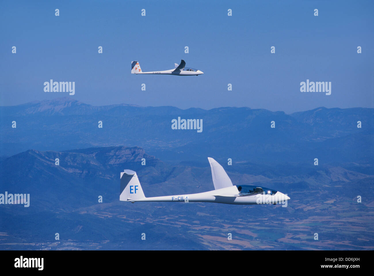 Two glider planes Duo Discus flying in wave flight near Jaca, Aragon