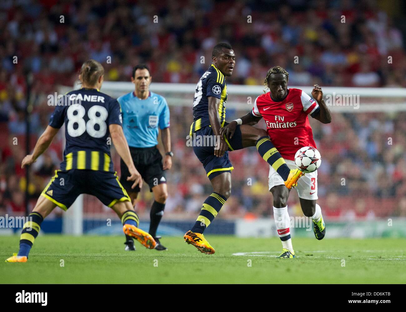 London, UK. 27th Aug, 2013. Bacary Sagna of Arsenal and Emmanuel Emenike of Fenerbahce during the Champions League 2nd leg Qualifier between Arsenal and Fenerbahce from the Emirates Stadium. Credit:  Action Plus Sports/Alamy Live News Stock Photo