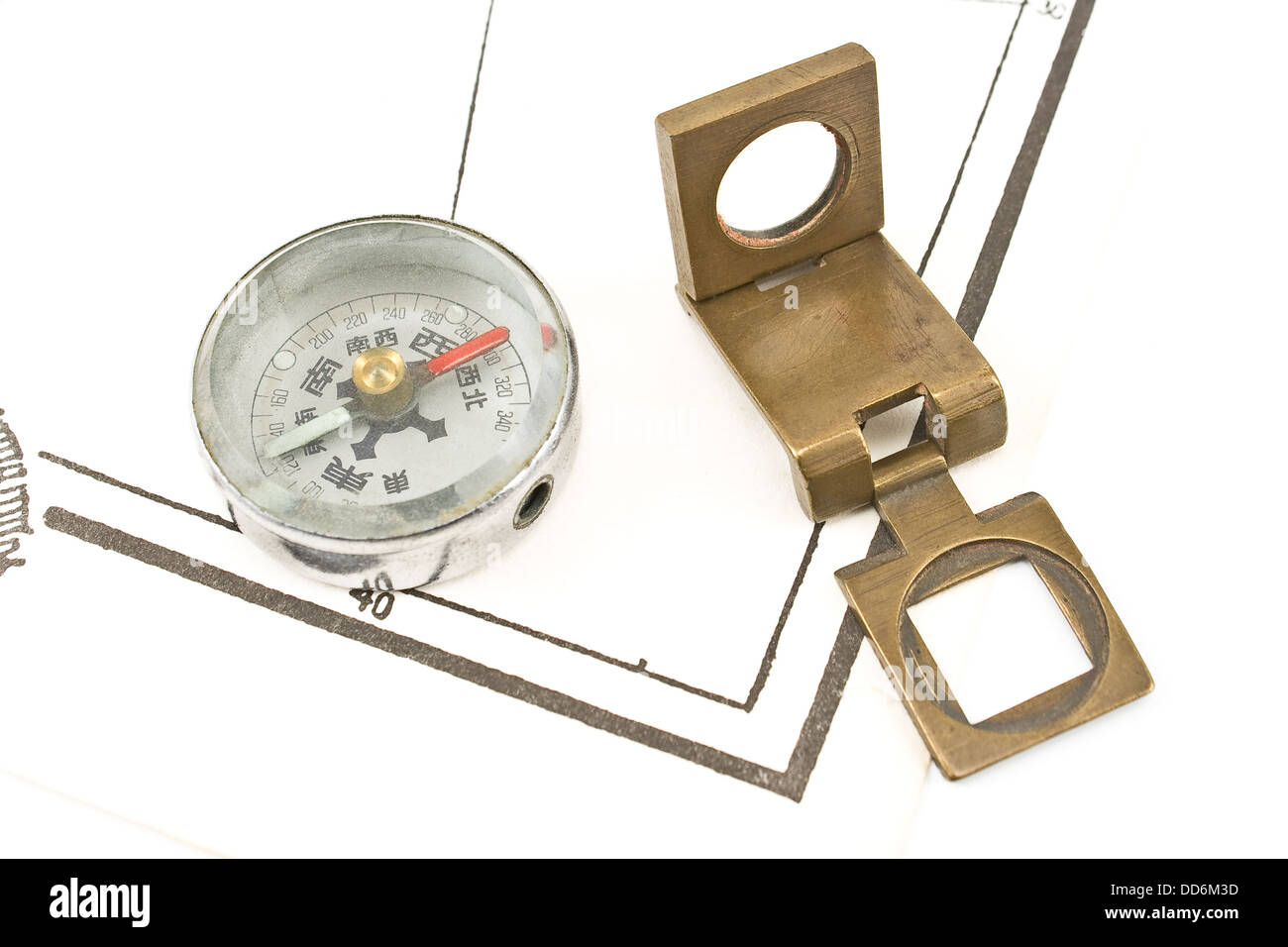 Antique compass and magnifying glass on map Stock Photo - Alamy