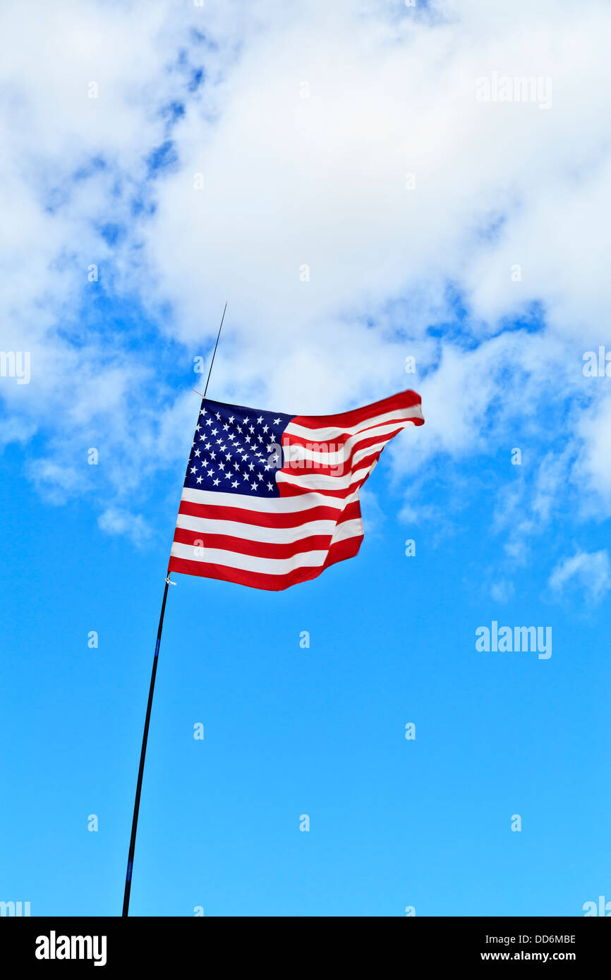 American flag flying atop a flagpole Stock Photo Alamy