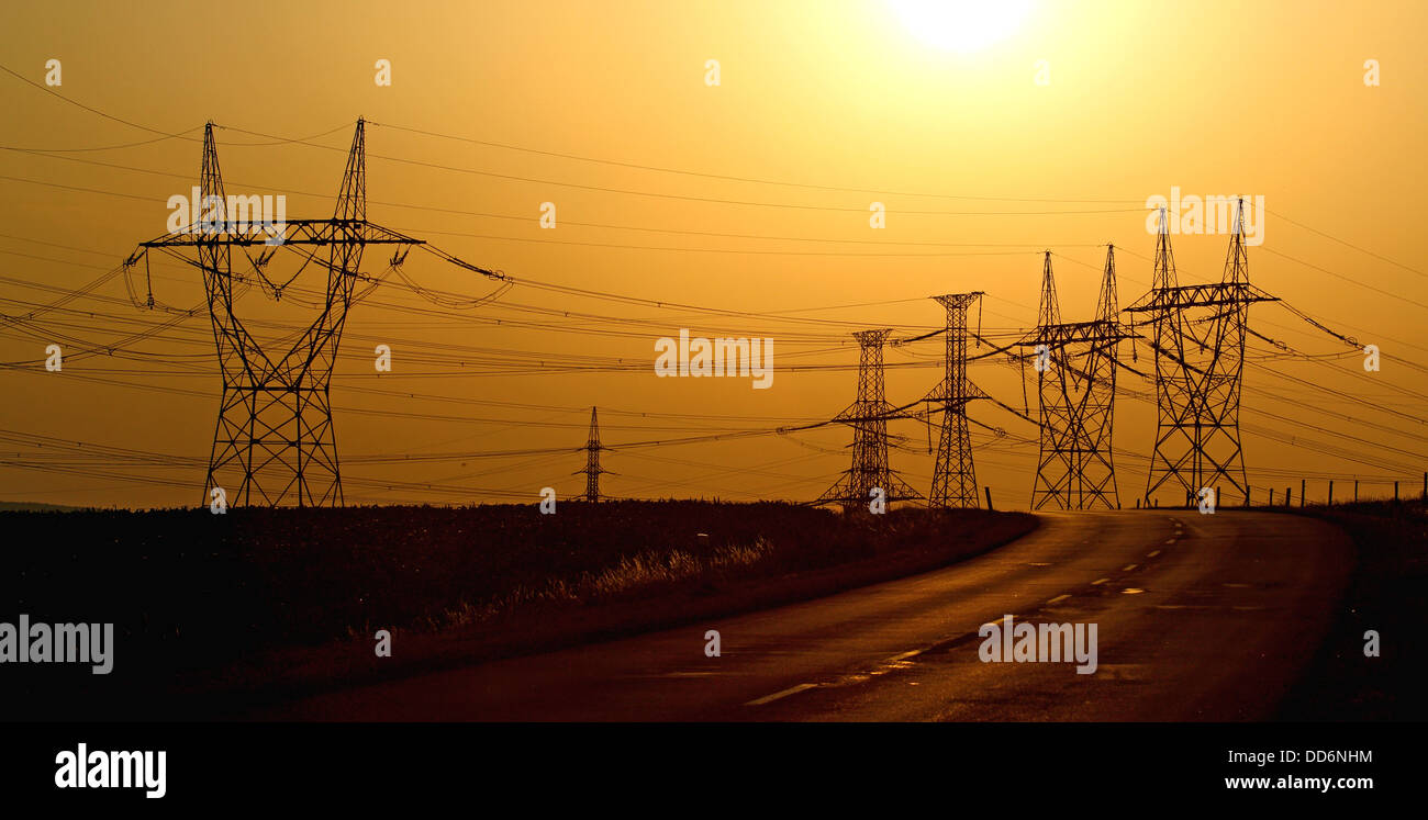 high voltage electric towers during sunset Stock Photo - Alamy