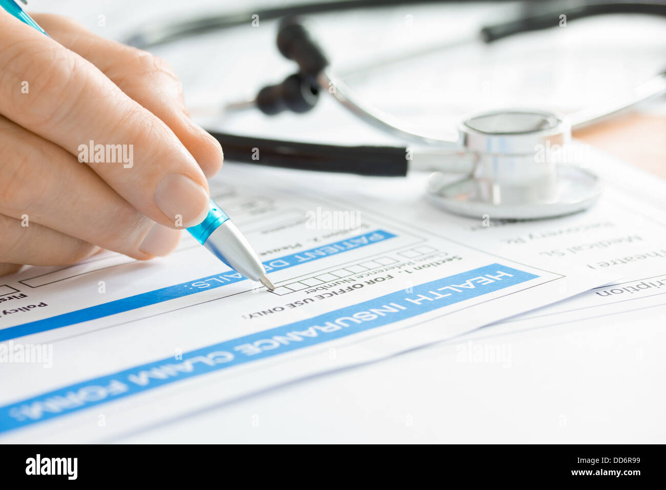Doctor with Stock Photo Medical Claim Stethoscope and ... Form