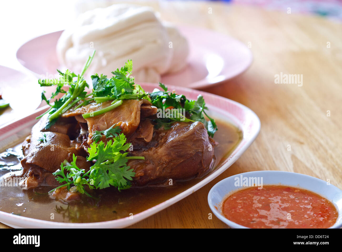 Pork leg stew in plate eat with mantou Stock Photo Alamy