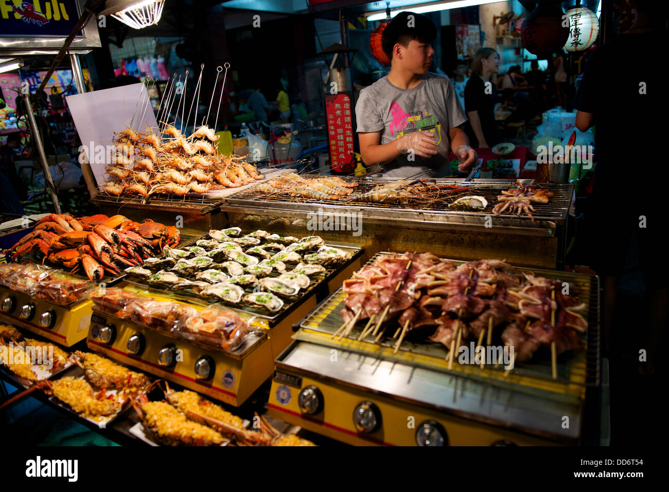 One of the many night markets in Kaohsuing, Taiwan.  Selling all sorts of snacks and drinks for locals and tourists Stock Photo