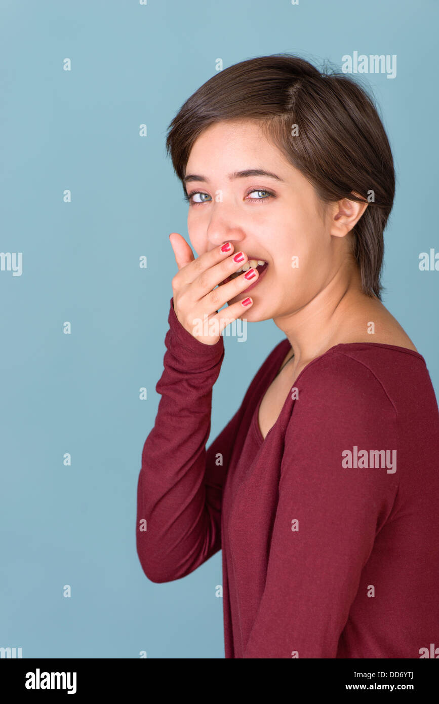 Portrait of young multiracial woman yawning Stock Photo