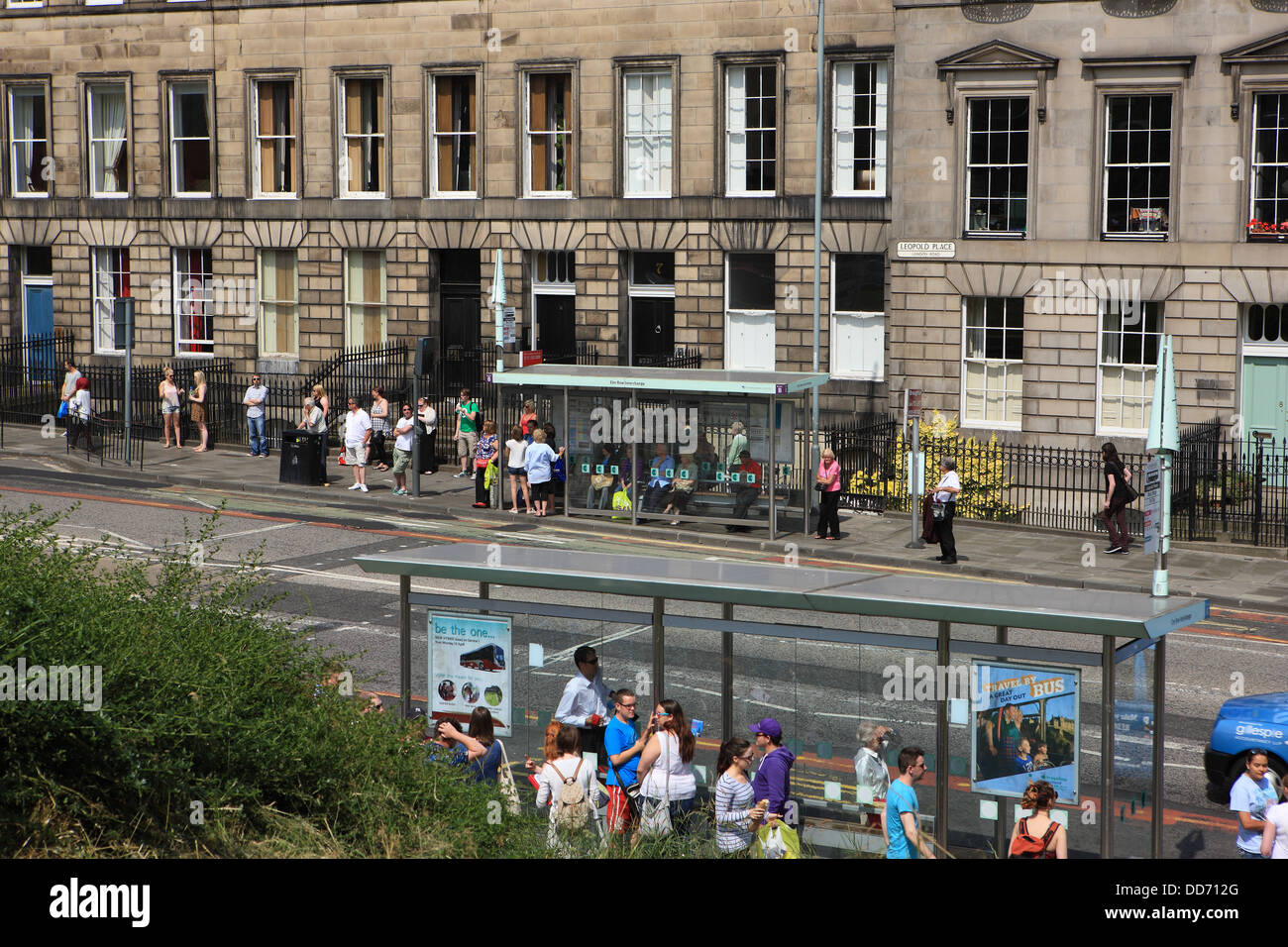 People waiting at bus stops in the centre of Edinburgh, Scotland Stock Photo