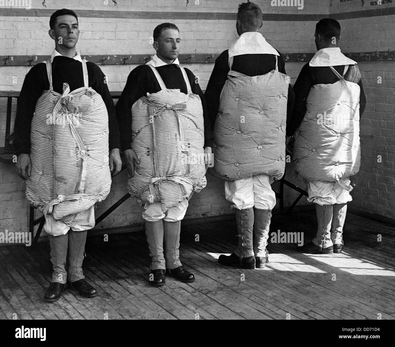 Navy recruits with their mattresses tied to them to serve as life preservers. Newport Naval Training Station, Rhode Island. Stock Photo