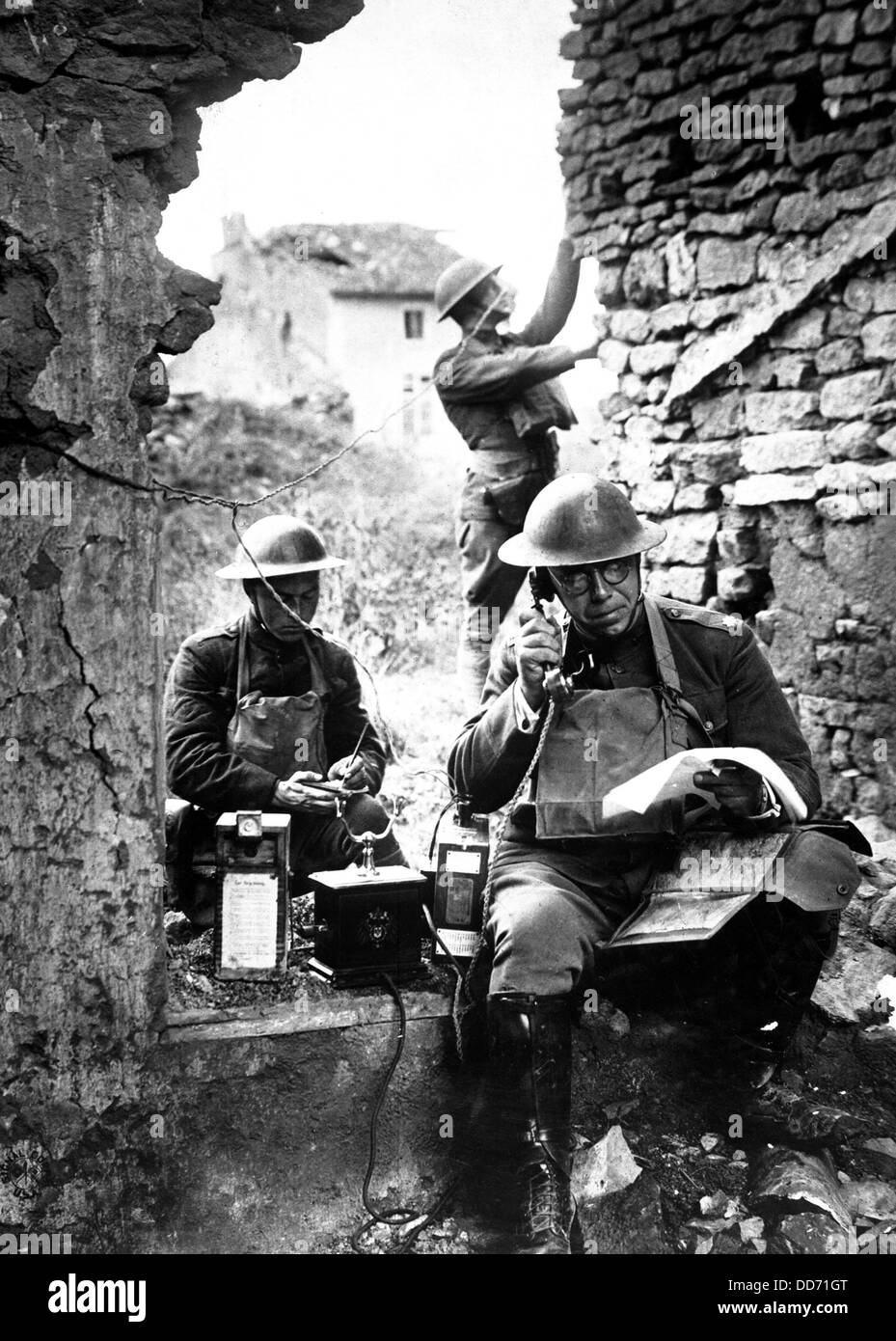 American signal officer of the 42nd Division, testing a telephone left behind by retreating Germans in the St. Mihiel salient. Stock Photo