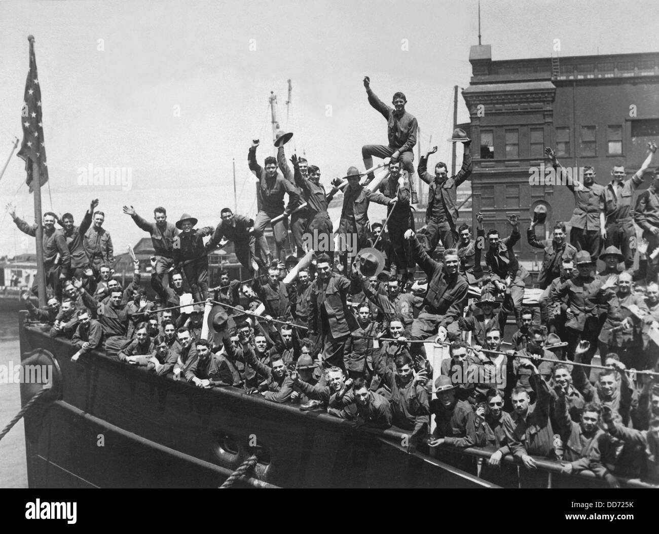 U.S. Soldiers wave from a troop ship embarked for France. World War ...